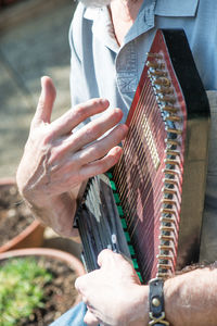 Close-up of man playing guitar