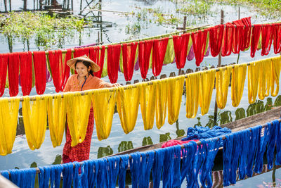 Full frame shot of multi colored clothes drying against blurred background