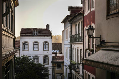 Exterior of buildings in town against sky