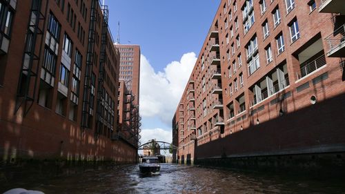 Low angle view of buildings in city against sky