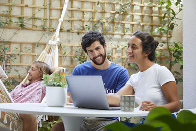 Young woman using laptop at home