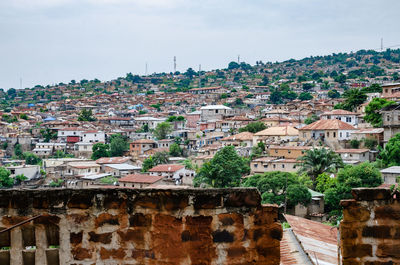 Houses in town against sky