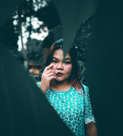 Portrait of a smiling girl between leave