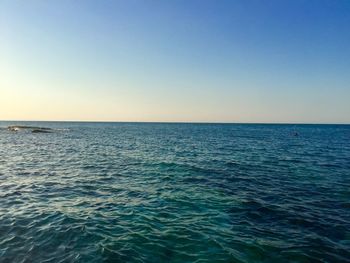 Scenic view of sea against clear blue sky