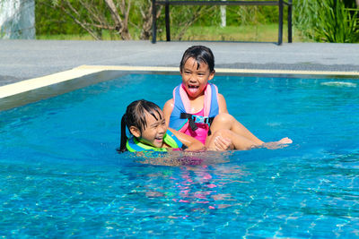 Boy swimming in pool