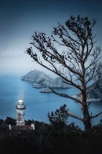 Scenic view of sea by buildings against sky