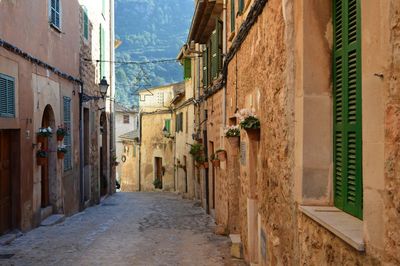 Narrow street amidst buildings in town