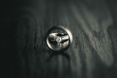 Close-up of wedding rings on table