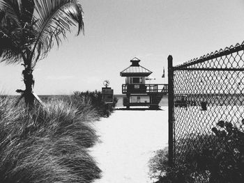 Lifeguard hut on beach against clear sky