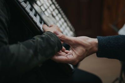 Close-up of hand holding hands