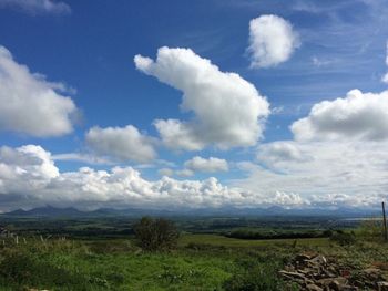 Scenic view of landscape against cloudy sky