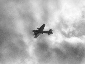 Low angle view of airplane flying in sky