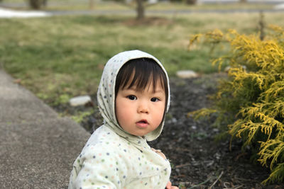 Portrait of cute baby girl sitting