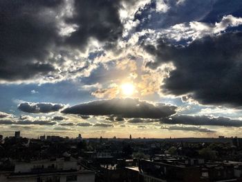 Scenic view of city against sky during sunset