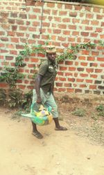 Full length of woman standing by railing