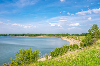 Summer scenic views of at lake against sky at the glenmore reservoir in calgary, alberta.