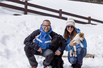 Full length of a dog on snow covered landscape during winter