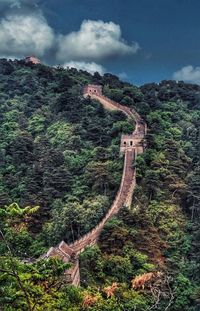 Scenic view of mountain against cloudy sky