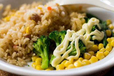 Close-up of fried rice and vegetables in bowl