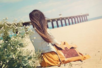Rear view of woman on beach