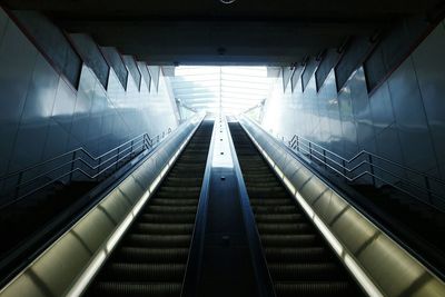 Low angle view of empty escalators in building