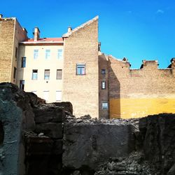 Houses against clear blue sky