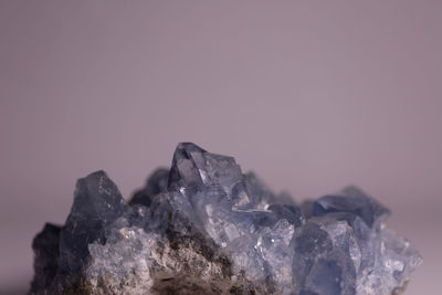 Close up of stone against gray background