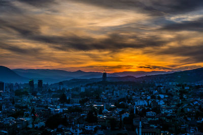 Cityscape against sky during sunset