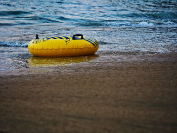 Close-up of yellow floating on sea