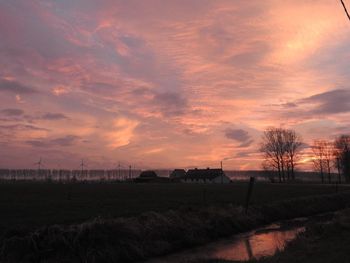 Scenic view of dramatic sky over landscape