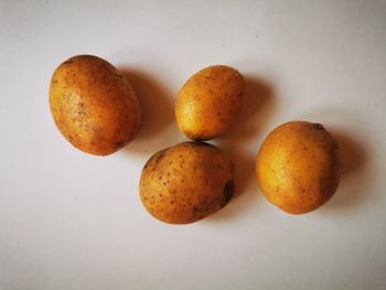 High angle view of oranges on white background