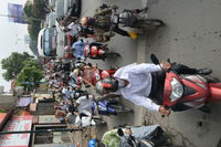 People riding motorcycle on street in city