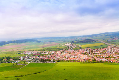 Aerial view of townscape against sky