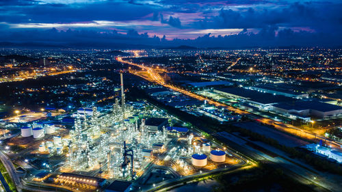 High angle view of illuminated city buildings at night