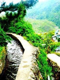 Scenic view of river with mountains in background