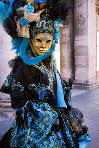 Woman wearing costume and mask during venice carnival