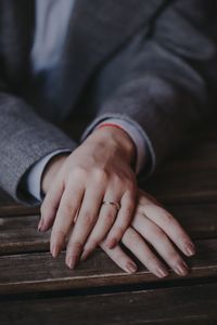 Close-up of hands on table