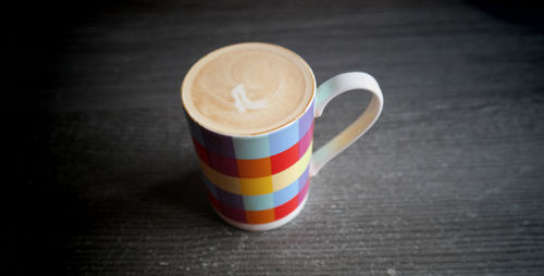 Close-up of coffee cup on table