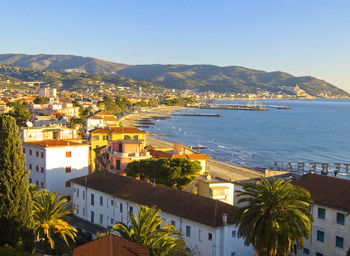 High angle view of townscape by sea