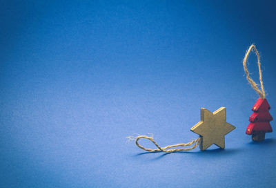 Close-up of christmas decoration against blue background