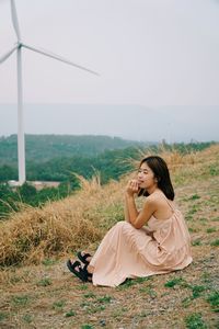 Woman sitting on a field