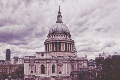Low angle view of st pauls cathedral against cloudy sky