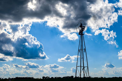 Low angle view of windmill against sky