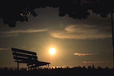 Silhouette trees against sky during sunset