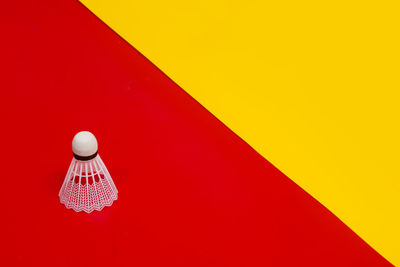 High angle view of illuminated lamp against orange wall