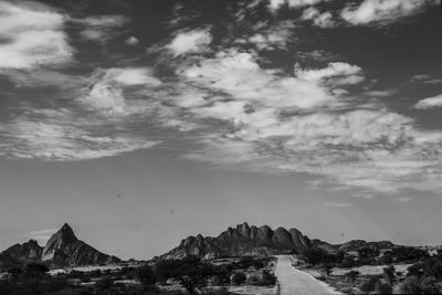 Panoramic view of sea and mountains against sky