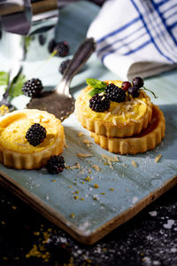 Delicious freshly prepared tartlets with berries and mint leaves