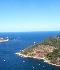 Scenic view of sea against clear blue sky