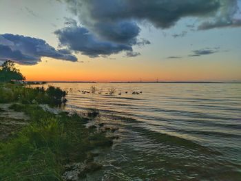 Scenic view of sea against sky during sunset