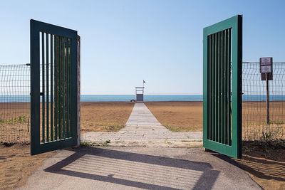 View of calm sea against clear blue sky